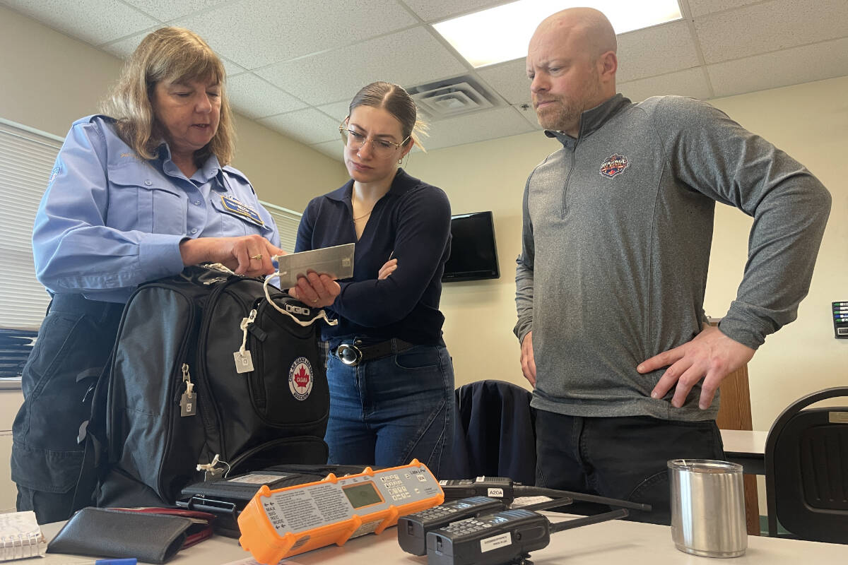 Trish Krol, Vanessa Waugh and Michael Steenvoorden prepare for a ground search exercise in North Saanich. (Christine van Reeuwyk/Peninsula News Review)