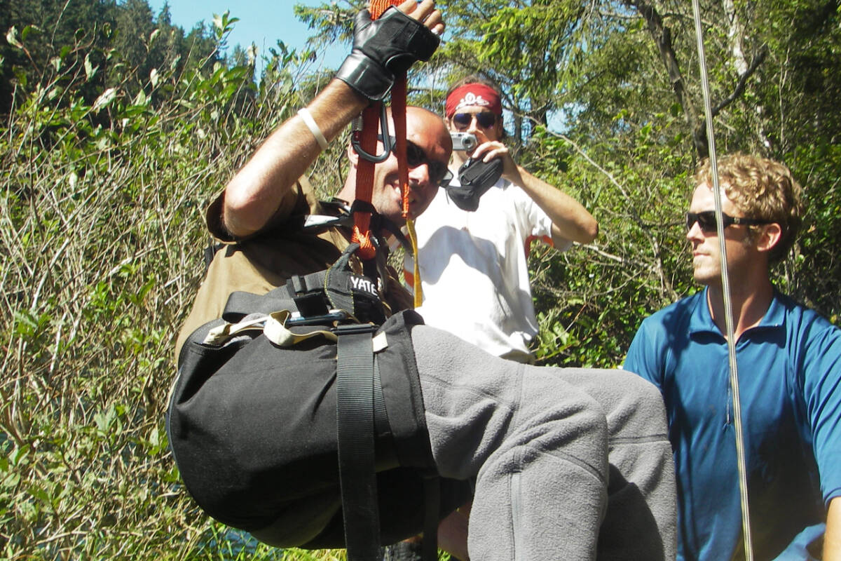 The late Brad Jacobsen, an avid outdoorsman who was quadriplegic, traverses one of Canada’s most difficult wilderness routes: the West Coast Trail, with some help from friends in 2005. (Courtesy 8 Fold Films)